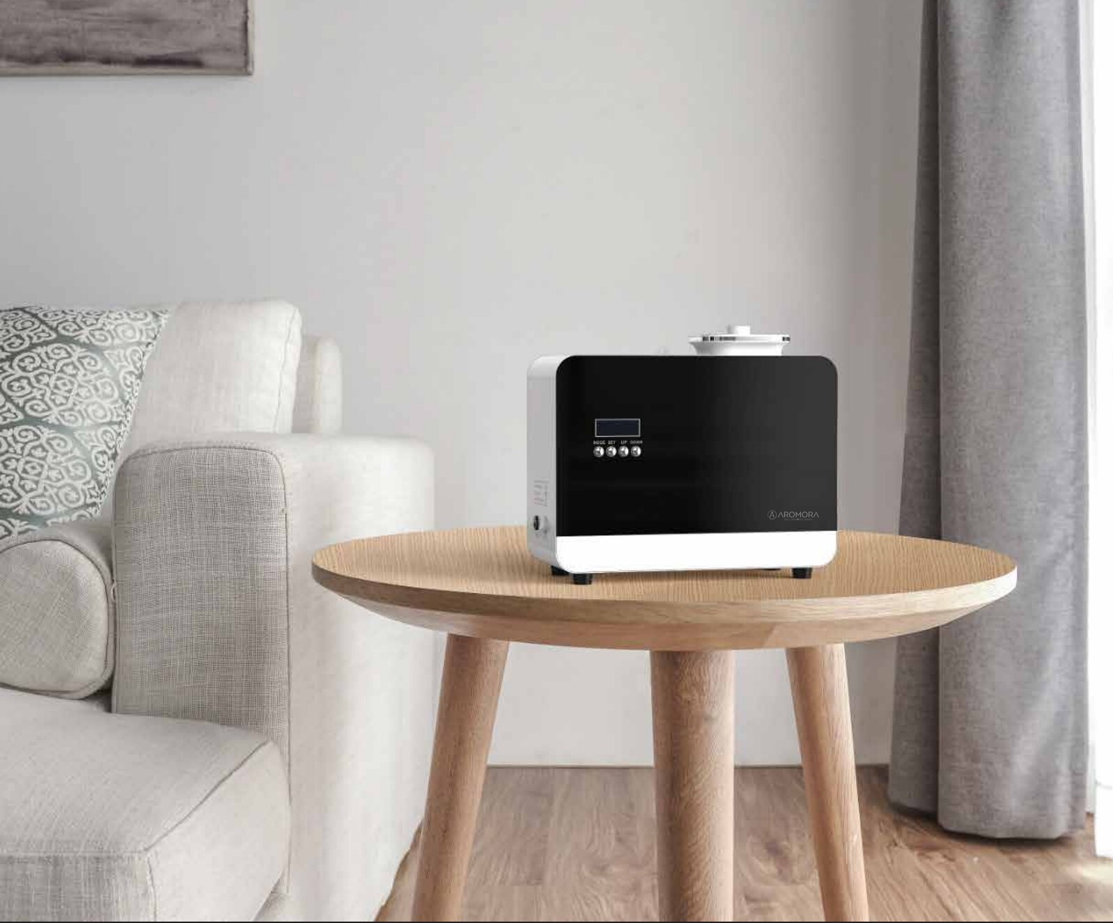 AROMORA scent diffuser displayed on a side table in a modern lounge